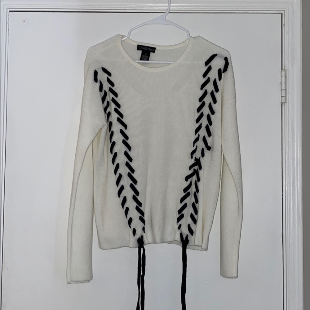 Fun white sweater with black ties!
